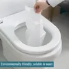 Le siège de toilettes couvre les doublures en papier d'eau soluble jetable pour les déplacements ou le coussin accessoire de salle de bain