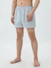 Shorts pour hommes Lounge pour femmes et hommes Couleur unie Fente latérale Confortable Taille élastique Sommeil Pantalon court tendance