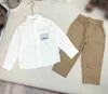 Tute da bambino di marca set da due pezzi per bambini di alta qualità Taglia 100-160 abiti firmati per bambini Camicia a maniche lunghe e pantaloni color kaki 24Mar