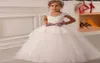 Vintage Cap ärmar Tutu Lace Flower Girl Dresses 2021 White First Communion Pageant Ball Gown for Girls Vestido de Comunion7883558