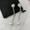 Boucles d'oreilles pendantes tendance Europe cristal perle goutte d'eau longue gland oreille pince femmes Top qualité cadeau de mariage Boutique bijoux de luxe