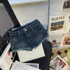 Pantaloncini da donna in denim estivo per donna con pantaloni Jean con bordo arricciato a vita ultra bassa