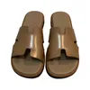 Дизайнер H Slippers Sandals and Slippers для женщин летом 2024 года Новая повседневная верхняя одежда с высокими кожаными мягкими подошвами Ленивые люди Плоские дни