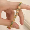 Braccialetti di fascino fiore di pesca alla moda per donne perle di perle di fiori regolabili intrecciano i braccialetti di gioielli alla moda di braccialetti di gioielli.