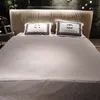 set di biancheria da letto di designset trapunta Letto a vento di grande marca di fascia alta quattro set di lusso leggero alto senso di atmosfera semplice set di lenzuola e trapunta marchio di moda cappello da letto