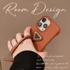 Luxuriöse Designer-Handyhülle mit metallischem Dreieck für iPhone 15 14 13 12 Pro Max, Leder-Haut-Rückseite, Riemen-Stil, Fingerband, rutschfeste Abdeckung