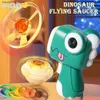 Novità Giochi Bambini Piattino Lanciatore Pistola Trottola per esterni Pistola per dinosauri con luce Disco volante Giocattoli Espulsione Giroscopio luminoso Q240307