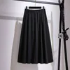 プラスサイズの太った姉妹は、ソリッドカラーのプリーツスカート秋の大規模なサイズのレディースウェア240307を備えた長い薄いAラインスカートのサイズの姉妹