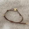 Französische Mode Instagram Nische minimalistische Persönlichkeit Titanium Stahl Gold plattierte triumpale Bogengewebewebkordelarmband für Frauen