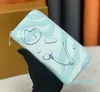 Créateurs de mode Zippy WALLET Hommes Femmes Cuir Portefeuilles à glissière Fleurs Porte-monnaie Sacs à main Porte-cartes en titane Embrayage