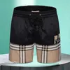 Shorts masculinos luxo mens e mulheres designer xadrez listrado shorts verão moda streetwear secagem rápida swimwear impresso placa praia calças ásia tamanho m-3xl 240307