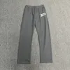 Pantalon gris lettre de haute qualité imprimement imprimé hiphop rue cordon pantalon hommes femmes femmes pantalon de survêtement lâche décontracté