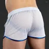 Shorts masculinos homens casual malha sexy respirável boxer cuecas transparentes bugle bolsa calcinha masculino ver através da calça tronco