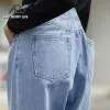 Pullovers ael vår jeans kvinna asymmetri hög midja lösa denim långa byxor för kvinnor tvättade bomull ljusblå mode streetwear