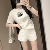 春の新しい高級デザイナーセクシーなファッション女性のTシャツショートスリーブプレスダイヤモンドショーツハイエンド服