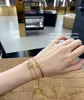 Französische Mode Instagram Nische minimalistische Persönlichkeit Titanium Stahl Gold plattierte triumpale Bogengewebewebkordelarmband für Frauen