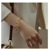 Goldarmband-Nageldesigner-Armreifen für Damen und Herren. Hochwertiges antikes Goldnagelarmband für Damen, Instagram, beliebt im Internet, einfaches, luxuriöses Nic-Logo