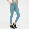 Pantalones activos Medias de talle alto Sin línea en T Fitness Yoga Pantalones de chándal con sentido desnudo Leggings elásticos para mujer Pantalones deportivos de color sólido con bolsillo en la cintura 240308