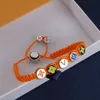 Bracciale a catena in corda di seta intrecciata a mano Creatività personalizzata europea americana fatta a mano Arcobaleno smalto colorato Coppia designer di gioielli per braccialetto con ciondolo da donna