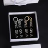 Lettre classique Pendentifs Boucles d'oreilles Femmes Mode Diamants incrustés Lettre Oreille Stud Designer Ligatures Alphabet Boucles d'oreilles Casual Lustre Laides Dangle Décoratif