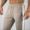 Hommes Alphalete marque hiver Fitness gymnases mode coton crayon musculation pantalon haut survêtement 240308