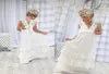 Romantische 2020 Neuankömmlinge Boho Blumenmädchenkleider für Hochzeit Günstiges V-Ausschnitt Chiffon Spitze abgestuftes formelles Kinderhochzeitskleid Custom M3763525