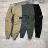 Pantalones deportivos rectos reflectantes con múltiples bolsillos elásticos y elásticos Cargo para hombre Joggers 240308