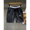 Pantalones para hombre Pantalones cortos ocasionales de seda de hielo finos de verano Ropa de abrigo Deportes sueltos Pantalones bordados de tendencia de cinco puntos