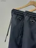 Pantaloni da uomo firmati 22ss Europe Coppia di fettucce classiche in tessuto Terry Tessuto personalizzato con cordoncino in metallo Ricamo a triangolo invertito 240308