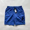 أوروبا مصمم رجال واحد عدسة جيب نايلون سراويل قصيرة غير رسمية تجفيف سريع CP شورت شورت شورت Sweatshorts الأولاد السباحة في الهواء الطلق.