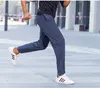 سروال الرجال على قيد الحياة de marque pour hommes summer men sports pants solid color litness running slim tremable Blue Black 240308