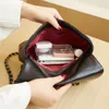 Venda de liquidação de bolsas de loja Baobao feminina 2024 nova bolsa de nuvem pequena corrente perfumada de vento lingge grande capacidade um ombro crossbody capa de couro macio maré