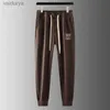 Męskie wysokiej klasy designerskie koronkowe ołówki spodnie boczne pasiastki żakardowe dzianiny spodnie na zewnątrz luźne spodnie dresowe 240308