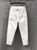 Cienkie dżinsowe dżinsy w rozmiarze dżinsowe dżinsy dla kobiet spodnie swobodny przycisk Koreańskie kieszenie modowe Elastyczne talia Pantalon Femme 240229