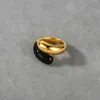 Nouvelle bague de bijoux à double tête en or noir émail goutte glaçure bague en laiton plaqué or véritable 18 carats bague de contraste de couleur pour les femmes en Europe et en Amérique