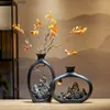 Vases New ical Style Black Hollowed-out Mountain and Sea Landscape Vase for Dried Flower Home Decor Living Room Tabletop Ornament L240309