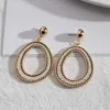 Boucles d'oreilles pendantes en cuir PU pour femmes, cadre couleur or, peau de serpent ronde, fenêtre découpée, bijoux, vente en gros, 2024