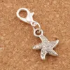 Dancing Flake Star Starfish Sea Charms 100pcs / lot 12 7x29 5mm Fermoirs à homard flottants en argent antique pour verre vivant C123280t