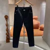 Cabeça de águia jeans masculino outono inverno elástico moda bordado tamanho 2940 calças compridas retas etiqueta de couro personalizada 240309