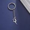 Nyckelringar Figur Gymnastik Key Chain Rostfritt stål Elegant Sports Stick Post Pendant Exklusiv kvinnamyckespresent till Sportsman