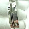 Bracelet à pression chaud Boutique maille de haute qualité en acier titane rouge ovale avec pièce à main en acier inoxydable diamant Cbz0