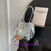 Luksusowe projektanty torby na buty wentylacje otwory wentylacyjne kaseta sklep internetowy 2023 Summer Nowa tkaninowa torba damska ręczna pierście