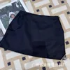 Kjolar designer svart triangel hög midja delad halva kjol kvinnors nylon a-line höft wrap p familj shorts kvinnor cbgk