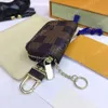 8 estilos Diseñador Hombres Llaveros Bolsas de coche Estuche Unisex Cartera de cuero genuino Titular de la cartera Mujeres Cremallera Llavero inteligente Estuches Coches Llavero con caja