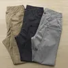 Herrbyxor avslappnad fast färg mjuk andningsbara nionde byxor med knappdragare stängningsfickor lätt för komfort