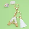 Keychains Zoshi Exquisite 26 Letters Harts Charms For Women White Tassel Nyckelringar Handväskor Tillbehör