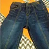 Jeans pour femmes 2023 Taille haute multi-boutons en métal épissage flamme pantalons pour femmes mode pantalon en denim ultra-mince et unique nouveau vêtement ample coréen J240306