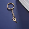 Nyckelringar Figur Gymnastik Key Chain Rostfritt stål Elegant Sports Stick Post Pendant Exklusiv kvinnamyckespresent till Sportsman