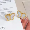 Studörhängen plågar gratis elegant skal 18k guldpläterad rostfritt stål snäckskal fjäril för kvinnor gåva