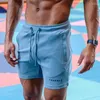 Mäns shorts manliga korta byxor som kör gym tight rosa träning joggar sport med lyx elastiskt mode i bulk